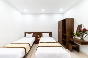 Voodi või voodid majutusasutuse Đà Lạt Cao Nguyên Hotel toas