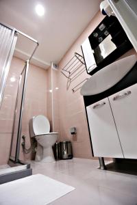 a bathroom with a sink and a toilet at Istanbul Family Apartment in Istanbul