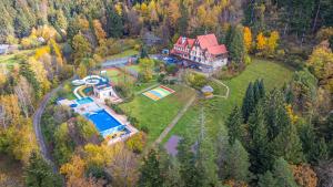 an aerial view of a large house with a pool at Hotel Sluníčko in Ostravice