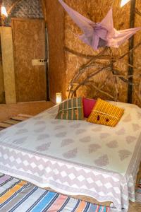 a bed with a pink bow on top of it at Saraya in Sangolda