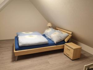 Postel nebo postele na pokoji v ubytování Ferienwohnung 24 Oben Rechts 4 Zimmer
