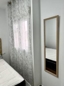 Кровать или кровати в номере RockSide Residences Suites La Línea N1 +6 фотографий