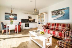 Kuchyň nebo kuchyňský kout v ubytování Haus Strandläufer Apartment 1 6 DeichLounge