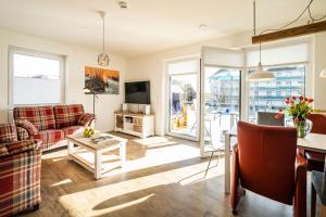 Posezení v ubytování Haus Strandläufer Apartment 1 6 DeichLounge