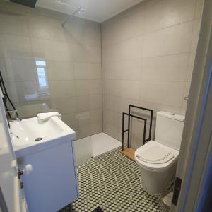 a bathroom with a toilet and a sink at São Lázaro Appartment by Demsimmo in Lisbon