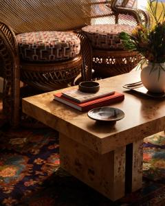 a coffee table with books and a bowl on top at Graduate Berkeley in Berkeley