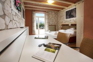 Voodi või voodid majutusasutuse Albergo Garni Orchidea toas
