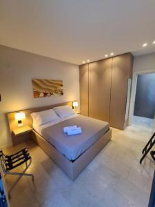 En eller flere senge i et værelse på B&B La Porta sul Mare a Porto Cesareo