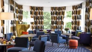 Posezení v ubytování Le Manoir Hôtel