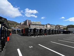 an empty parking lot with a row of portable toilets at HOTEL R9 The Yard Fukuyama in Fukuyama