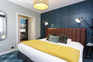 Postel nebo postele na pokoji v ubytování Le Manoir Hôtel