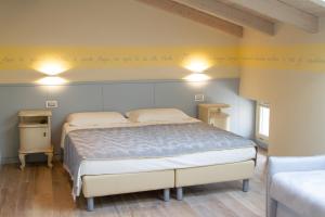 a bedroom with a bed with writing on the wall at Villa di Cazzano - BioLuxury Living in Soave