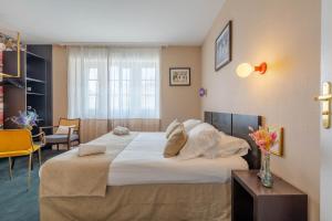 Postel nebo postele na pokoji v ubytování Ama Hôtel