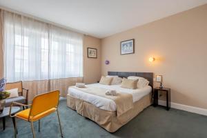 Postel nebo postele na pokoji v ubytování Ama Hôtel