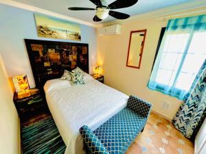 a bedroom with a bed and a ceiling fan at Elegant apartment in Amarilla Golf - FW 411 in San Miguel de Abona +43 photos