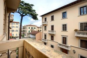 a view from a balcony of buildings at Mamo Florence - Magenta Apartment in Florence
