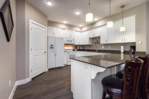 a kitchen with white cabinets and a counter top at W304-Mojave Skies Poolside 4 Bed Estancia Resort in St. George