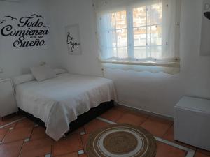 Postel nebo postele na pokoji v ubytování Habitaciones en Casa Céntrica con piscina