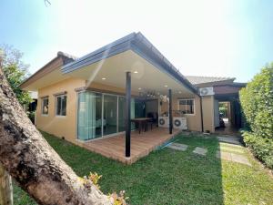 a house with a deck in the yard at Private house Casa seaside Rayong in Ban Chak Phai