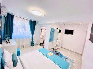 TV a/nebo společenská místnost v ubytování IANIS Rooms