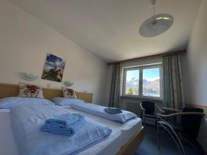 Letto o letti in una camera di Frühstückspension Monika, B&B in Kaprun including SUMMERCARD