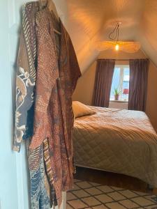 Postel nebo postele na pokoji v ubytování Lomma Station Inn Loft