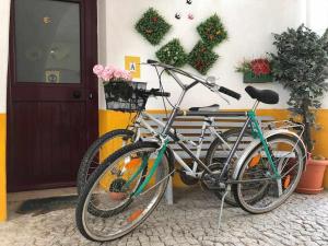 two bikes parked in front of a building at Évora City Break Apartment with Patio in the Historic Centre in Évora