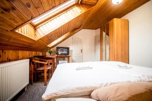 Postel nebo postele na pokoji v ubytování Hotel Squash Centrum