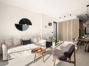 a living room with a couch and a table at JnV Luxury Villas in Chania Town