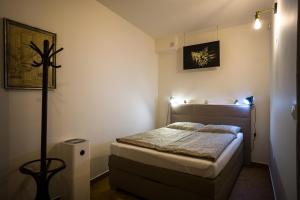 Postel nebo postele na pokoji v ubytování A7 Apartments