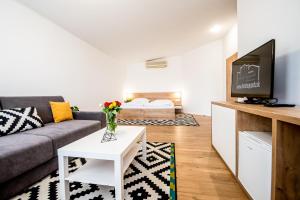 TV a/nebo společenská místnost v ubytování Hotel Squash Centrum