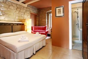 Voodi või voodid majutusasutuse Albergo Garni Orchidea toas