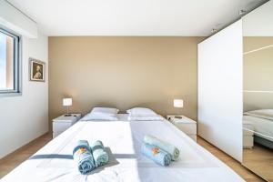 Łóżko lub łóżka w pokoju w obiekcie Baie Roquebrune, Balcon Vue Mer, Parking Gratuit - AO
