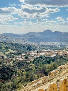 a view of a city from a hill at Grandpa House in Wadi Musa