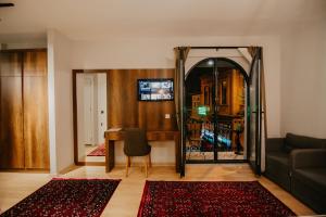 a living room with a mirror and a table at Copper House in Trabzon