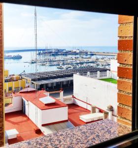 a view of a marina from the balcony of a building at Ancla Spaces nuevo apt cerca del mar, sin vistas in Vinarós