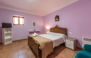 Łóżko lub łóżka w pokoju w obiekcie Rapia. Casa Rosa 2