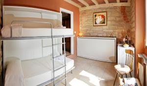 Voodi või voodid majutusasutuse Albergo Garni Orchidea toas