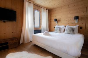 Posteľ alebo postele v izbe v ubytovaní Luxury Wood Megeve village