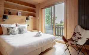 Posteľ alebo postele v izbe v ubytovaní Luxury Wood Megeve village