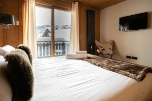 Posteľ alebo postele v izbe v ubytovaní Luxury Wood Megeve village