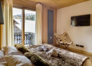 Posteľ alebo postele v izbe v ubytovaní Luxury Wood Megeve village + 37 fotografií