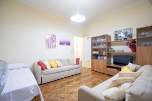 a living room with two couches and a tv at Kipseli 1 bedroom 5 persons apartment by MPS in Athens