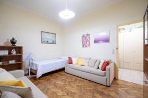 a living room with a couch and a bed at Kipseli 1 bedroom 5 persons apartment by MPS in Athens