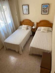 Posteľ alebo postele v izbe v ubytovaní Precioso apartamento en Urbanización Puerto Romano