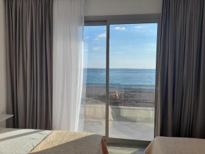 a hotel room with a view of the ocean at Anxhelos Hotel in Himare