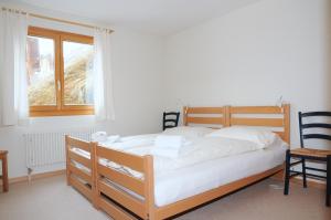 Postel nebo postele na pokoji v ubytování Ambiente Bettmeralp | A10