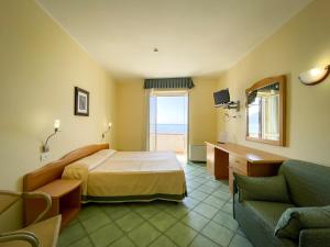 Postel nebo postele na pokoji v ubytování Albergo Da Carmine