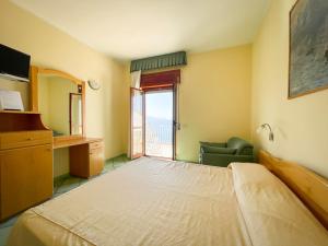 Postel nebo postele na pokoji v ubytování Albergo Da Carmine