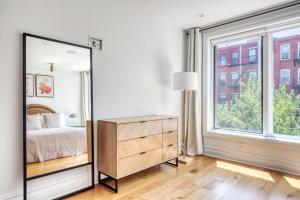 a bedroom with a bed and a large window at 2BR Gowanus Townhouse w WD nr Prospect Park NYC-883 in Brooklyn